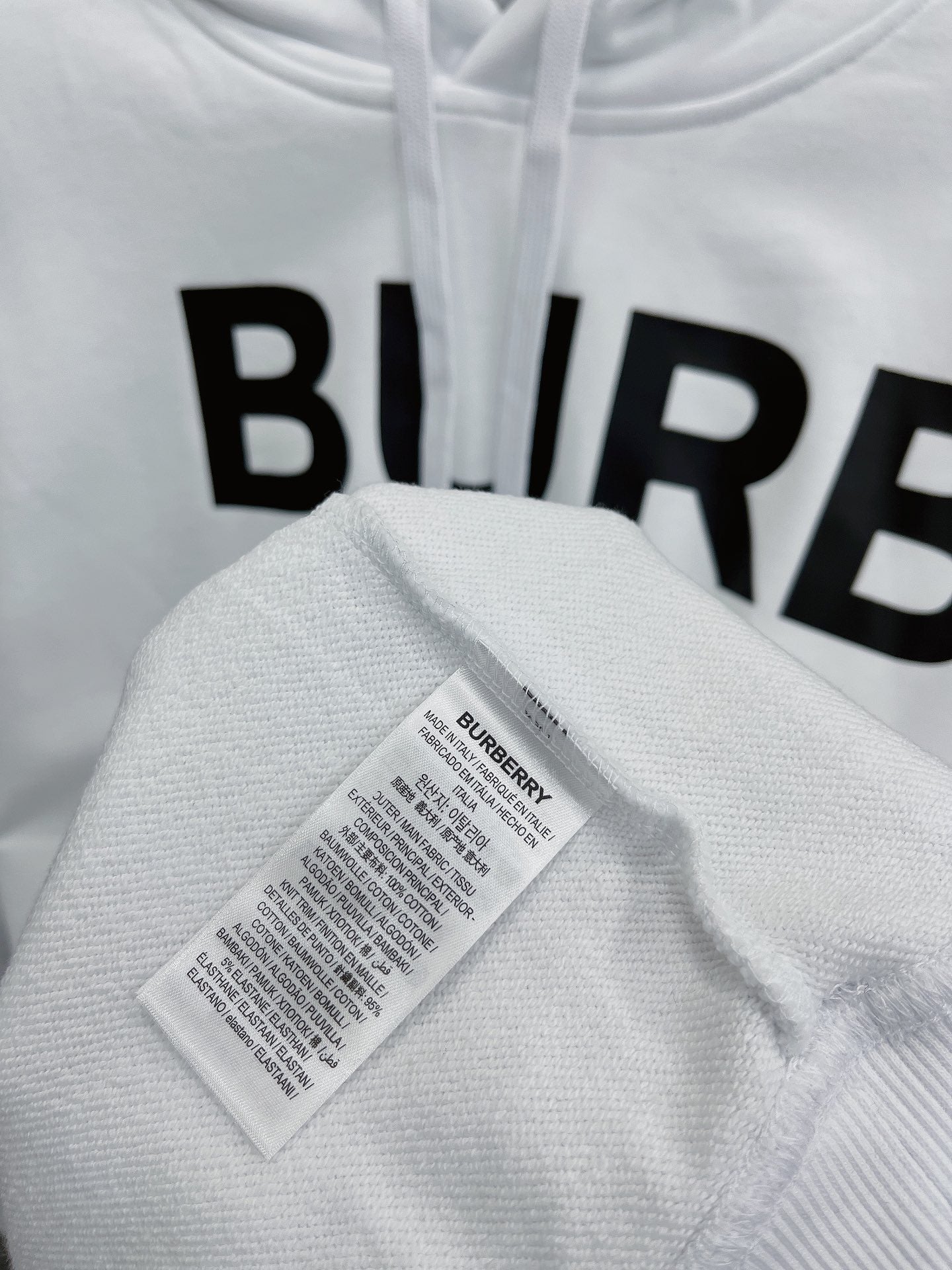 هودي أسود وبرتقالي فاتح وأبيض