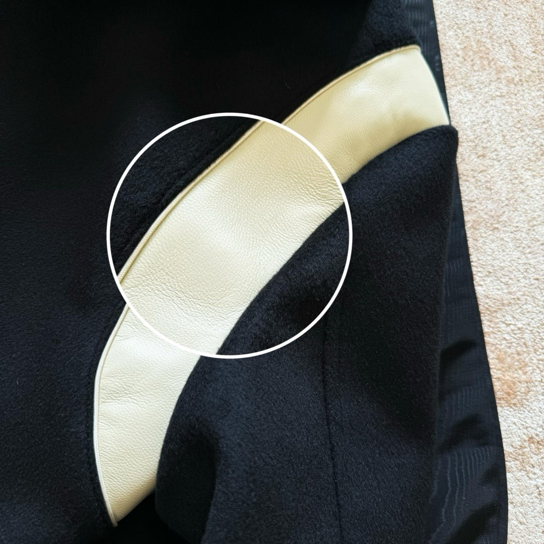 Schwarze weiße Jacke