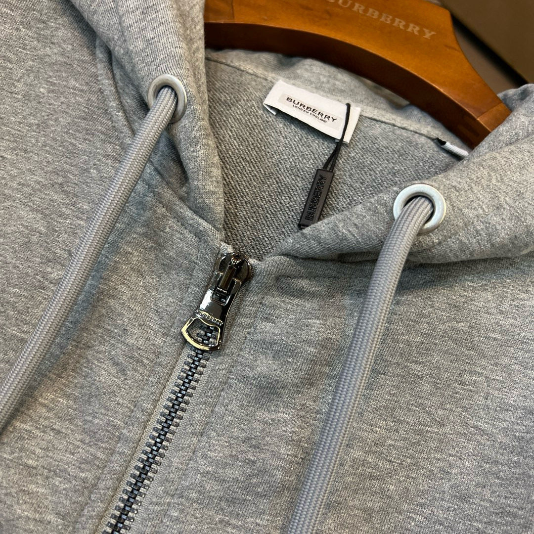 Schwarze und graue Jacke