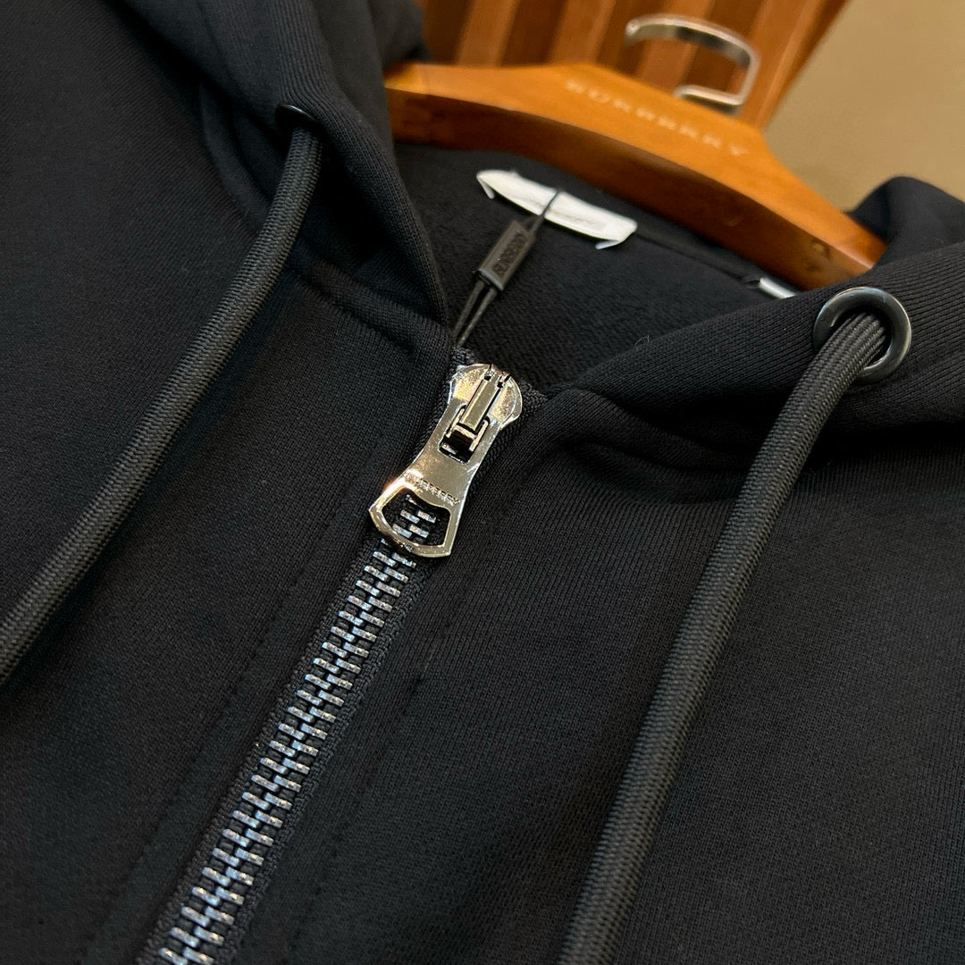 Schwarze und graue Jacke