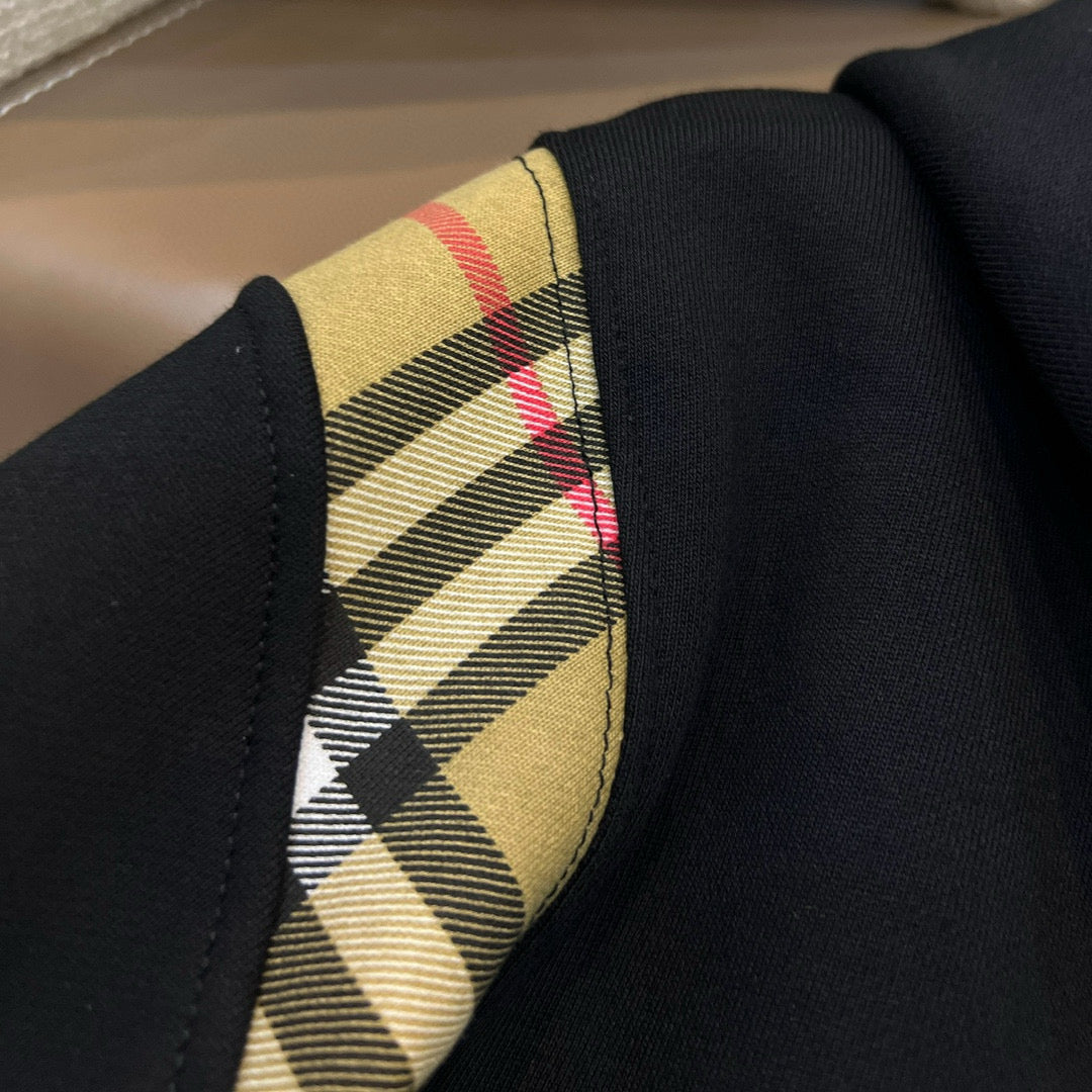 Schwarze und graue Jacke