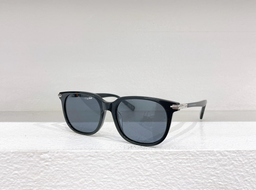 Schwarze, braune und weiße Sonnenbrille