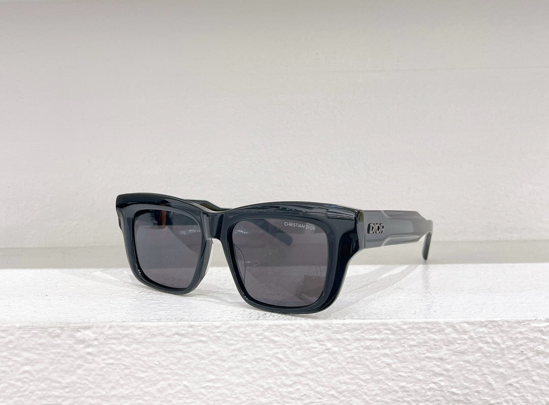 Schwarze, blaue, grüne und weiße Sonnenbrille