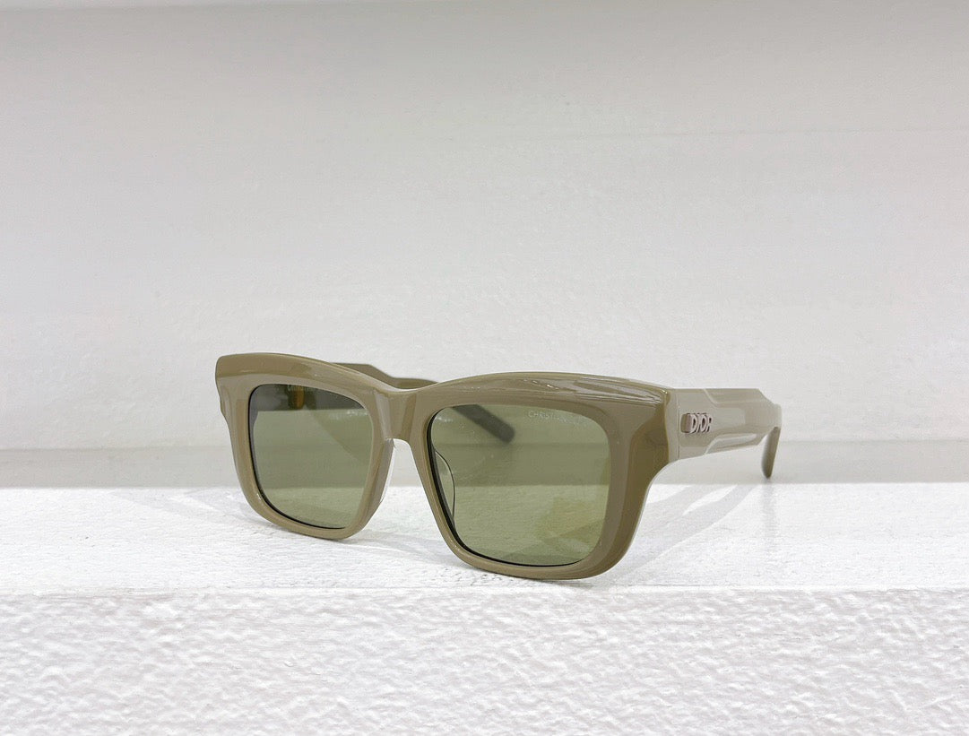 Schwarze, blaue, grüne und weiße Sonnenbrille