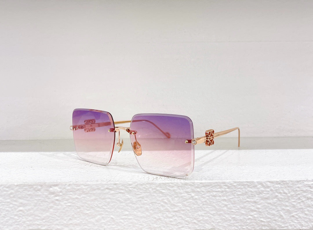 Blaue, braune, schwarze und rosa Sonnenbrille