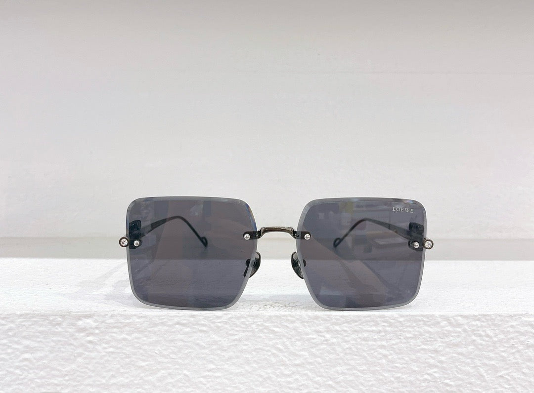 Blaue, braune, schwarze und rosa Sonnenbrille
