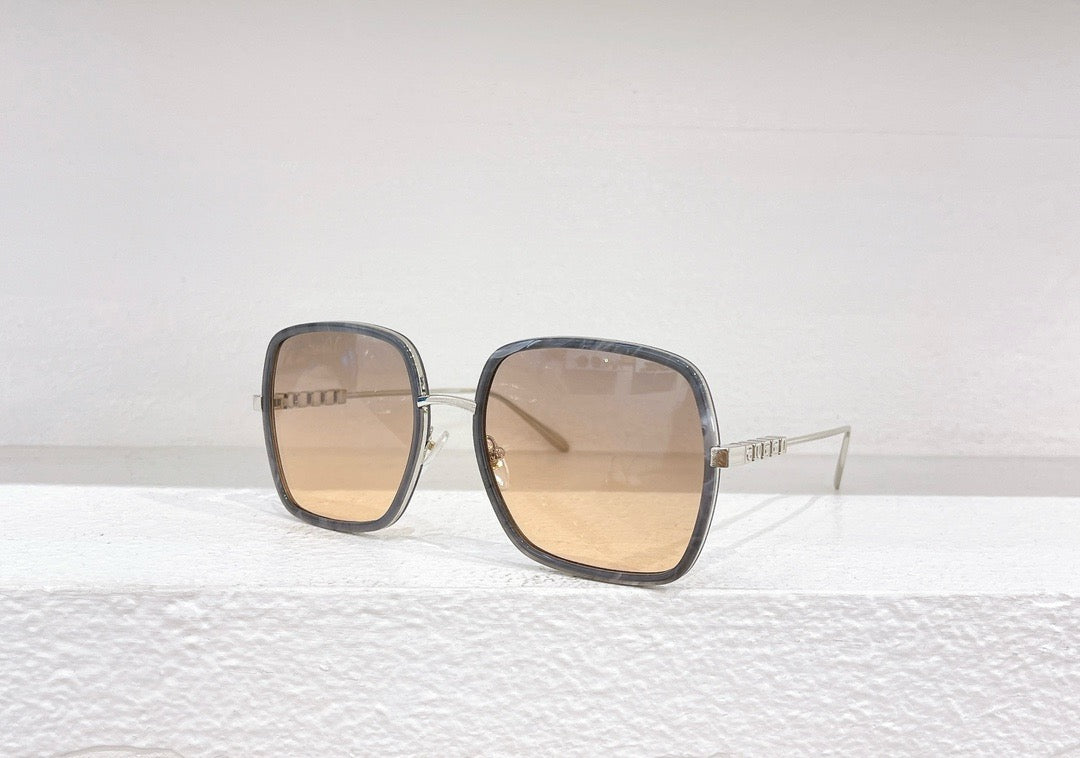 Rosa, braune und schwarze Sonnenbrille