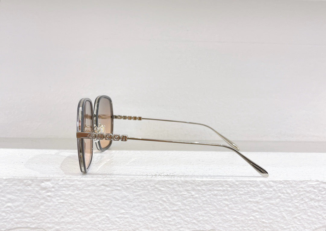 Gafas de sol rosas, marrones y negras