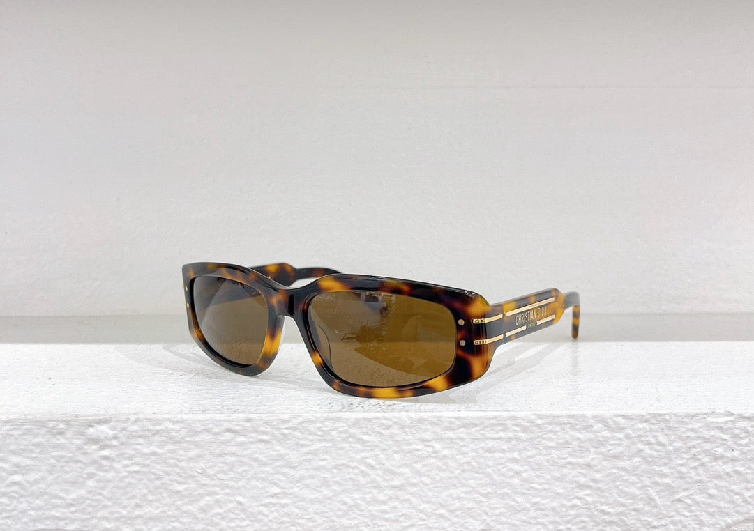 Schwarze, grüne und braune Sonnenbrille