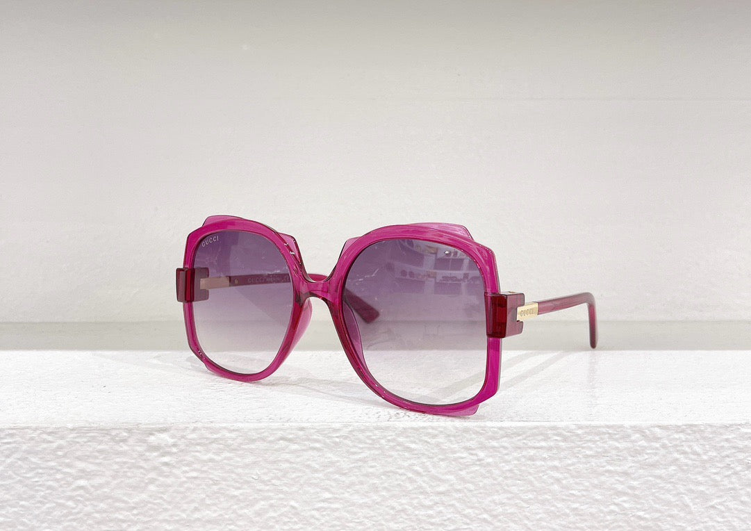 Blaue, rosa, weiße und schwarze Sonnenbrille