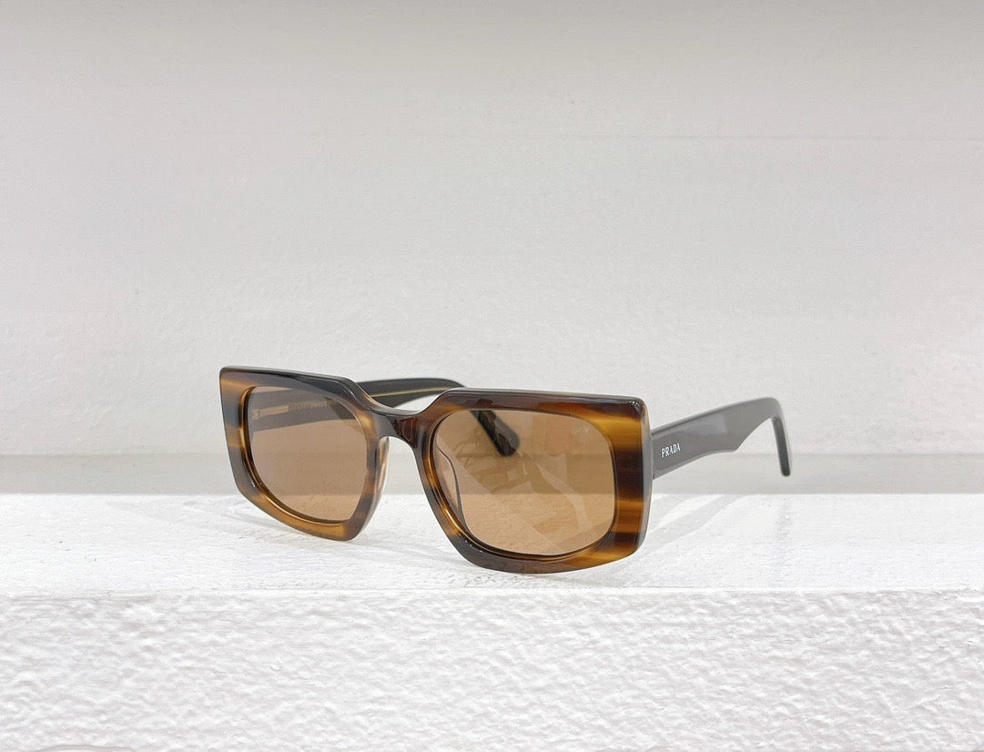 Schwarze, blaue, braune und graue Sonnenbrille