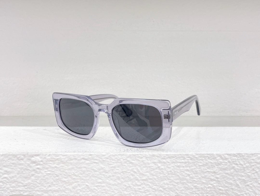 Schwarze, blaue, braune und graue Sonnenbrille