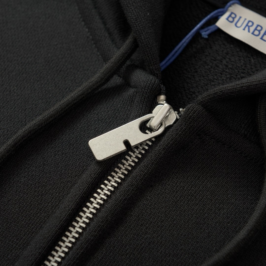 Schwarze und graue Jacke