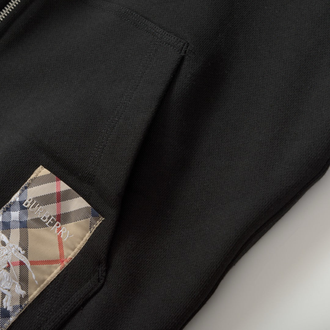 Schwarze und graue Jacke