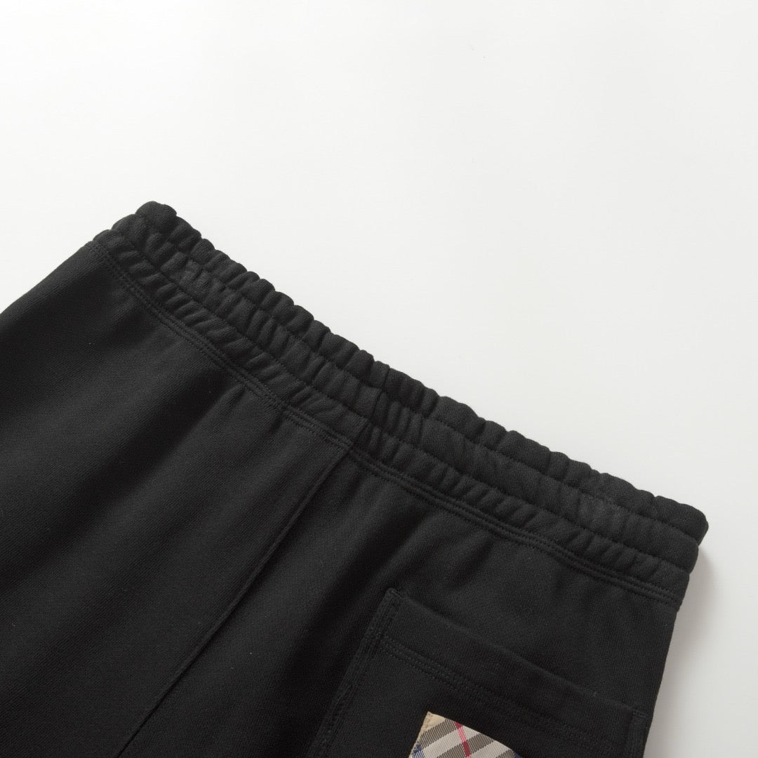 Schwarze und graue Hose