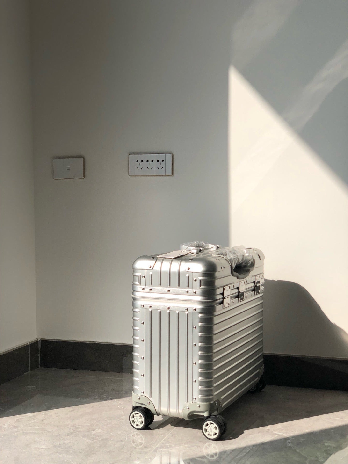 Silver and Black Suitcase