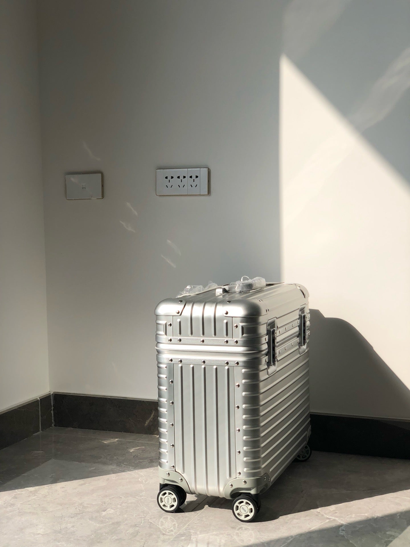 Silver and Black Suitcase