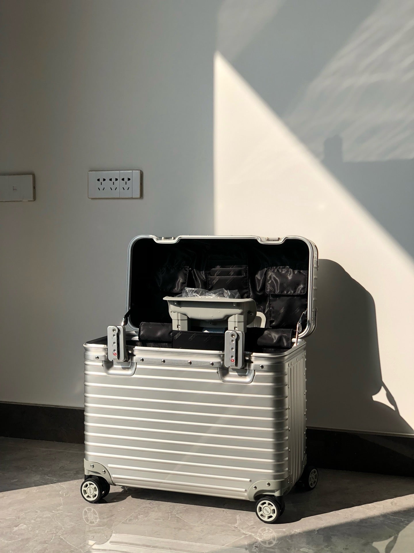 Silver and Black Suitcase