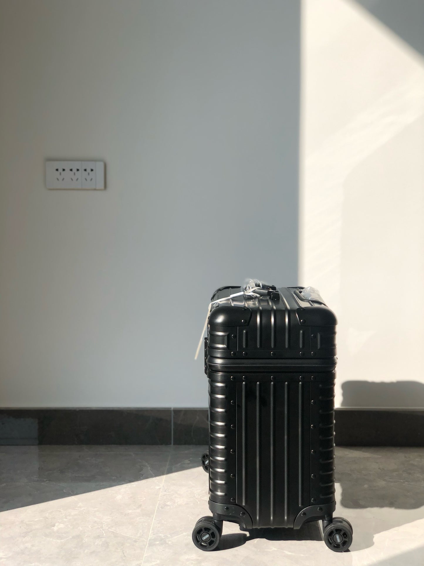 Silver and Black Suitcase
