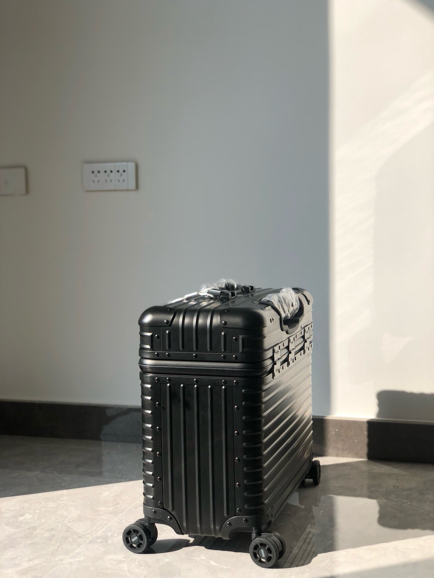 Silver and Black Suitcase