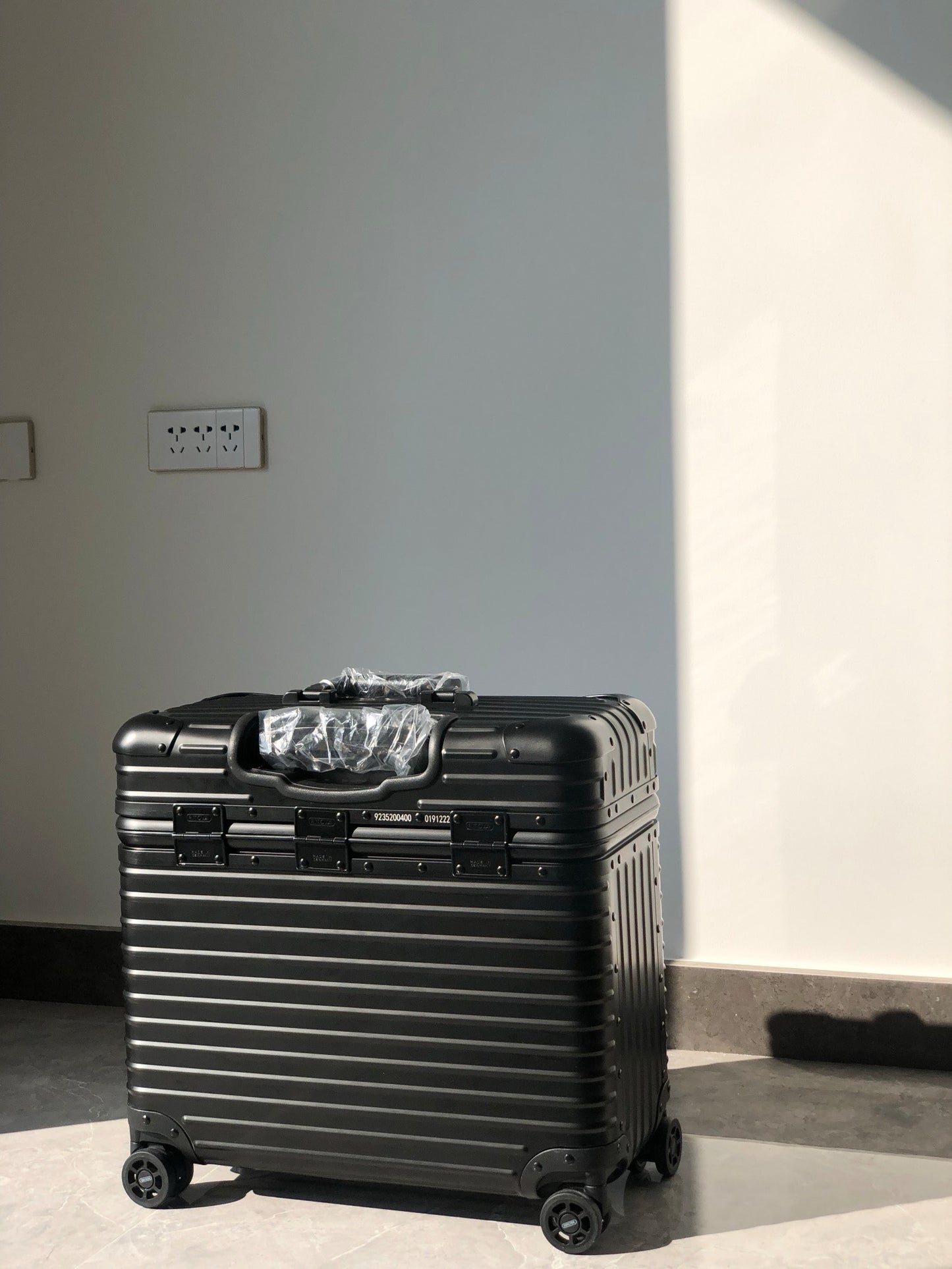 Silver and Black Suitcase