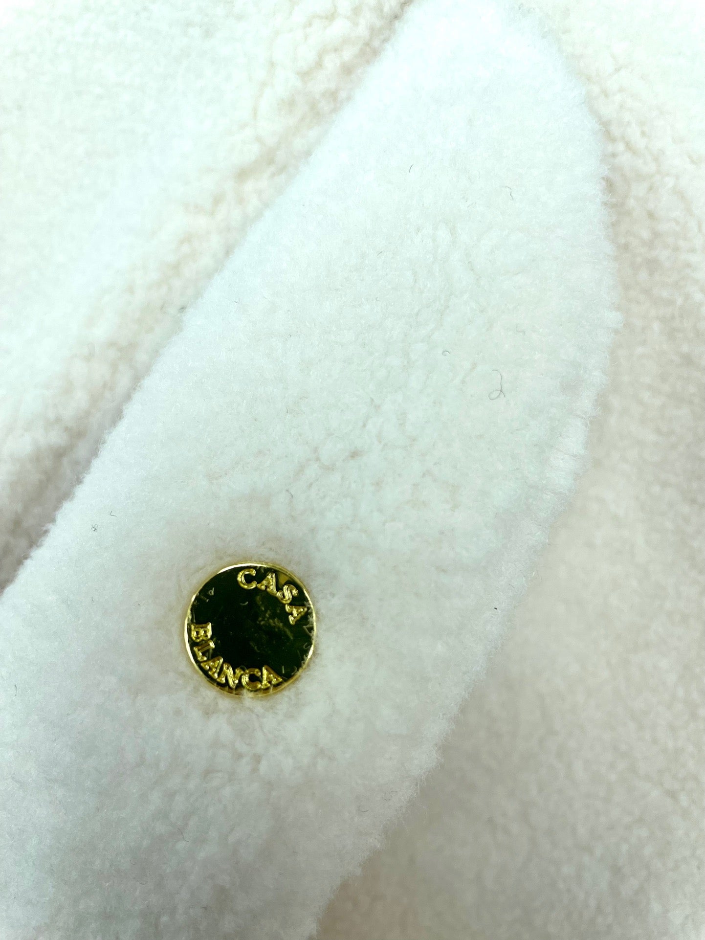 Schwarze und beige Jacke