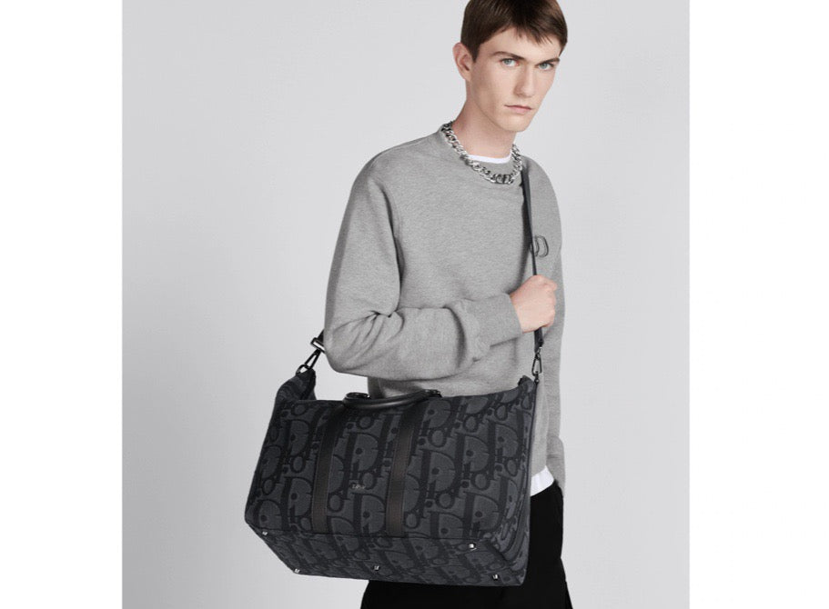Blaue und schwarzgraue Tasche