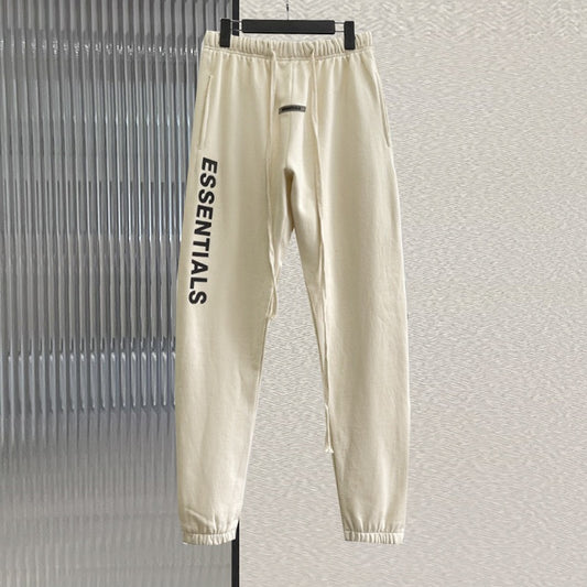 Pantalón negro, blanco y gris
