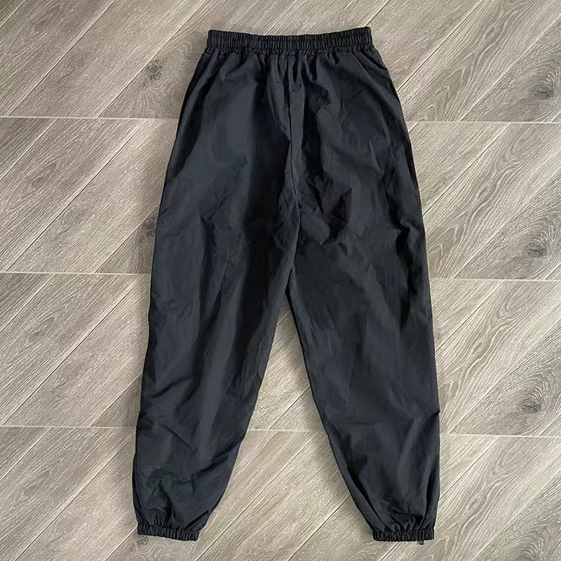 Schwarze und blaue Jacke mit Hose