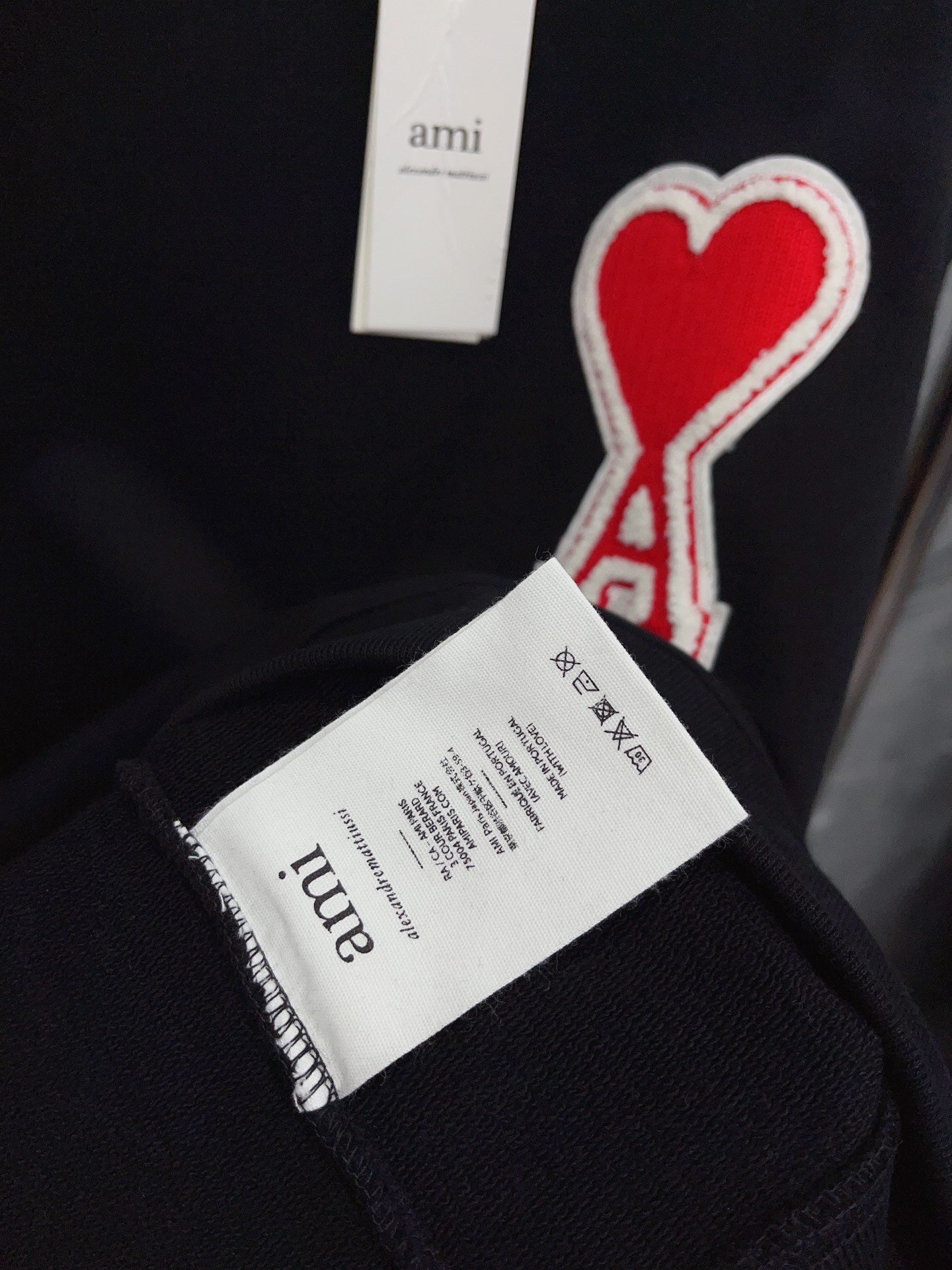 Jersey negro, gris y blanco