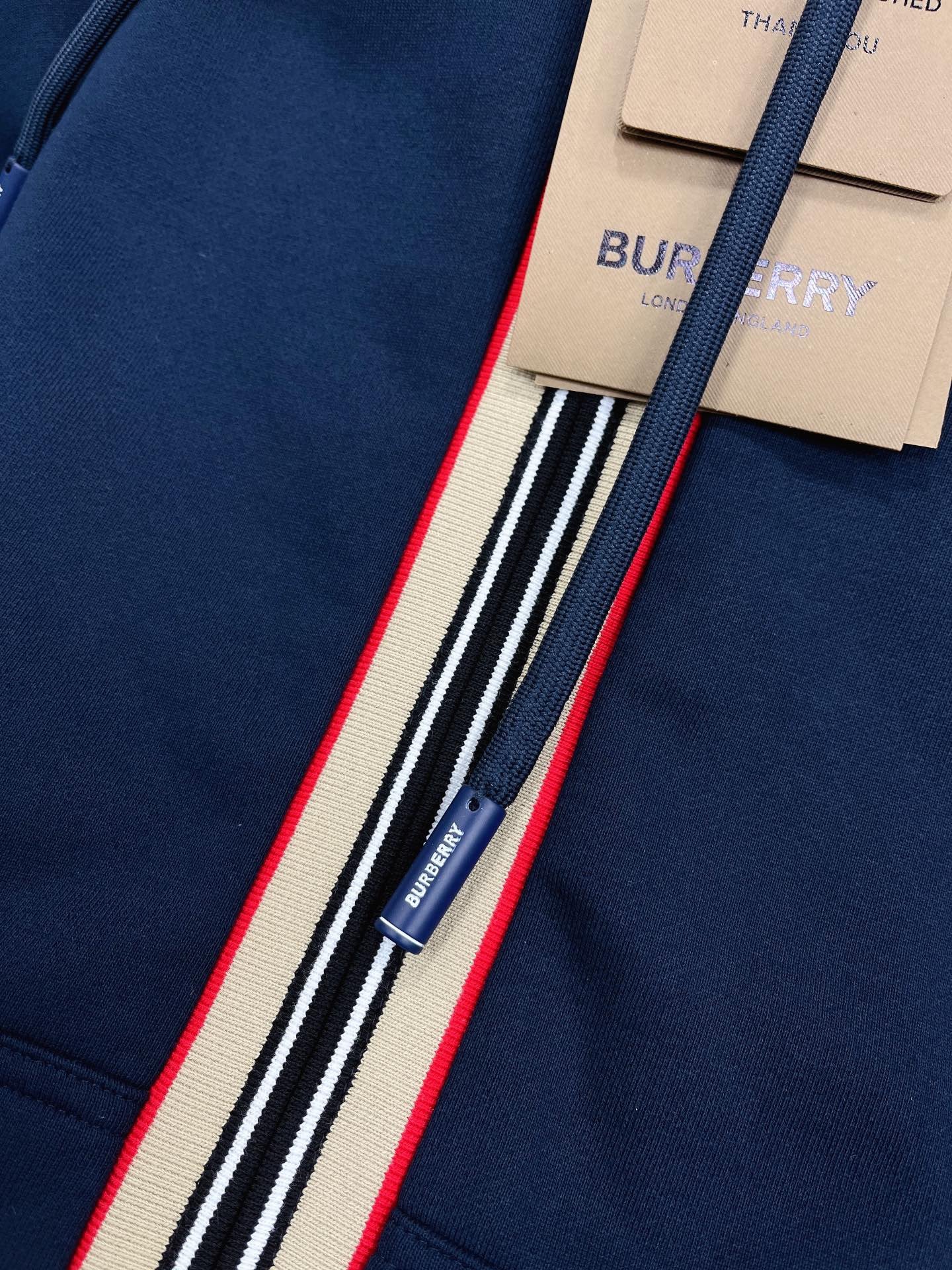 Schwarze, blaue und graue Jacke