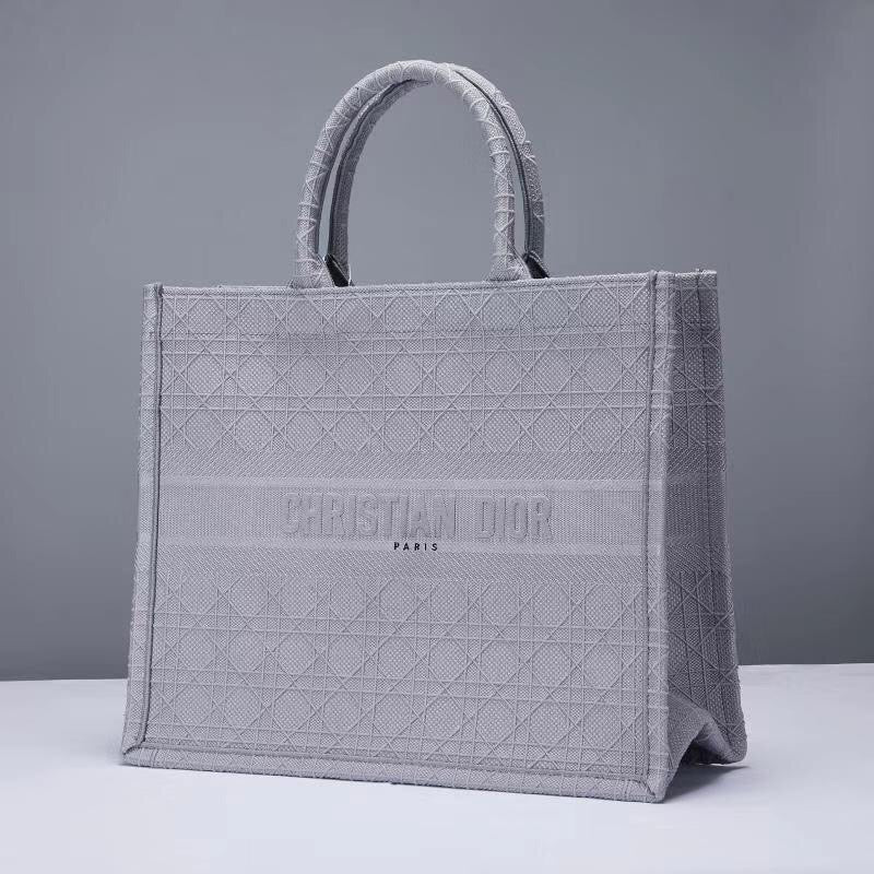 Schwarze, graue und pfirsichfarbene Taschen