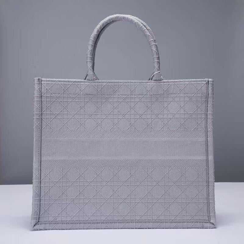 Schwarze, graue und pfirsichfarbene Taschen