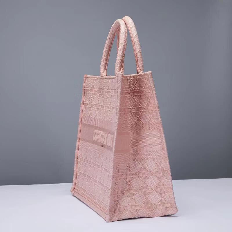 Schwarze, graue und pfirsichfarbene Taschen