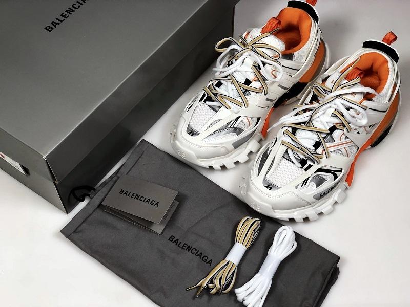 حذاء رياضي أبيض/برتقالي